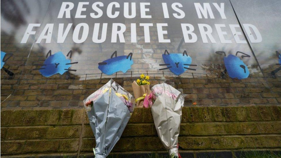 Flowers are left at Battersea Cats & Dogs Home in south London, where TV presenter and comedian Paul O'Grady worked as the charity's Ambassador.