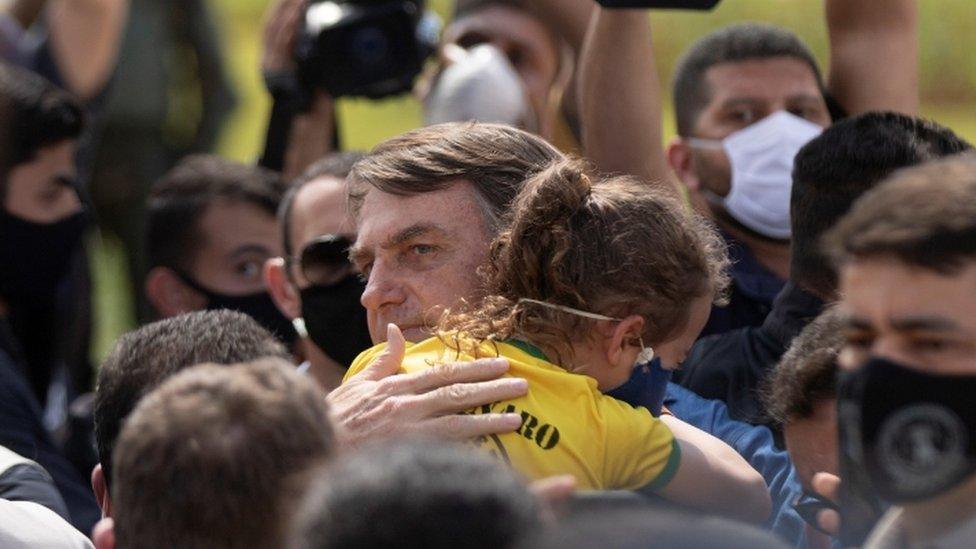 Brazilian president Jair Bolsonaro meets supporters during a demonstration, in Brasilia, Brazil, 24 May 2020.