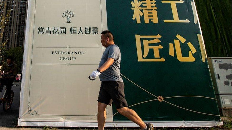 A resident walks through the Evergrande changqing community on September 24, 2021 in Wuhan, Hubei Province, China.