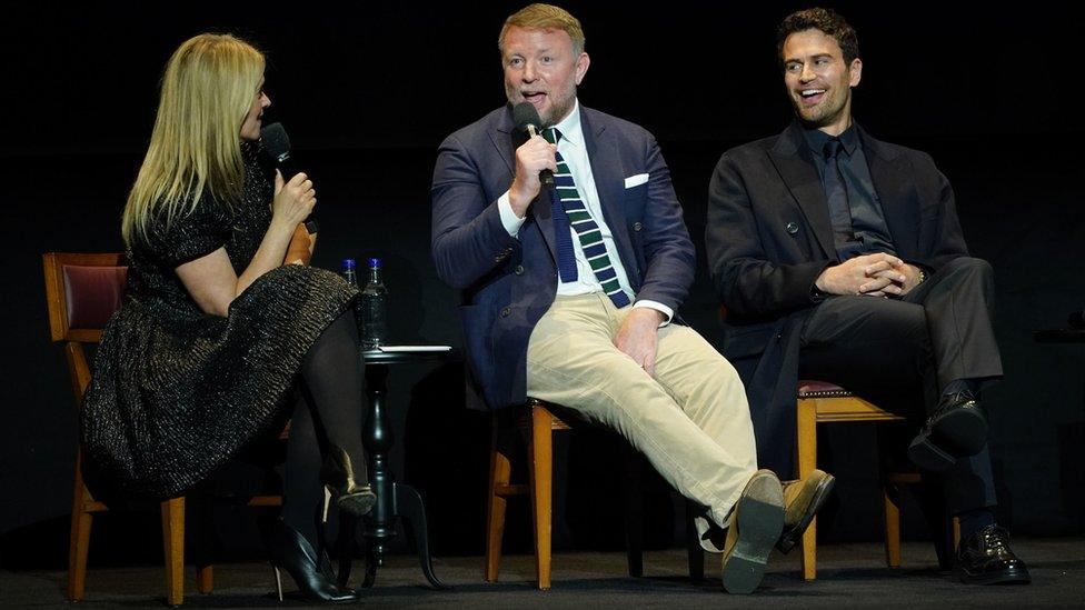 Guy Ritchie and Theo James on stage during a Q&A session after the screening for the premiere of the Netflix series The Gentlemen at the Theatre Royal Drury Lane, London