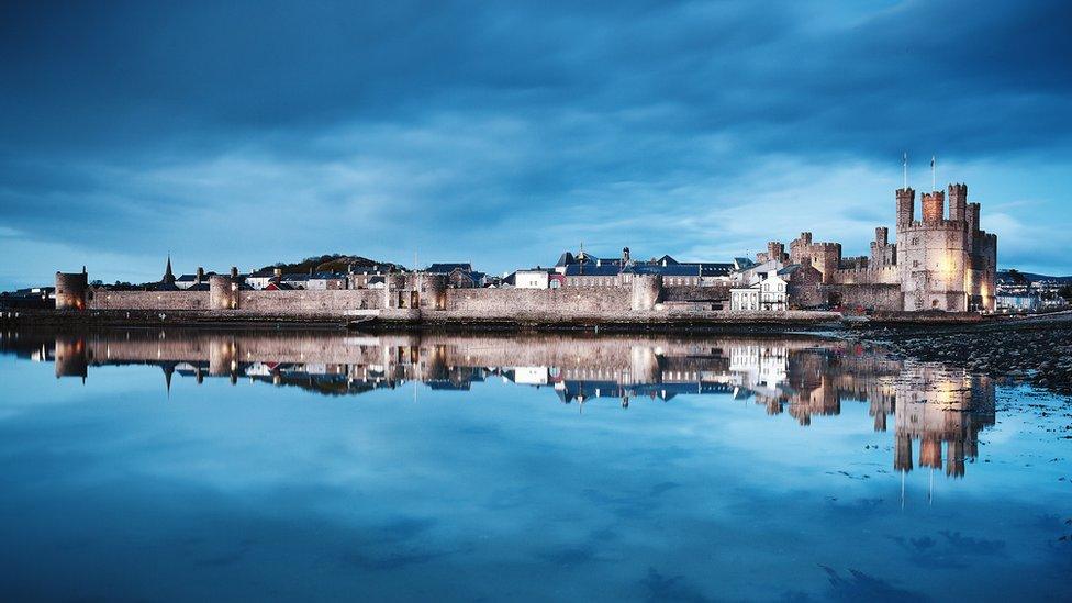 Caernarfon Castle reflecting in the water