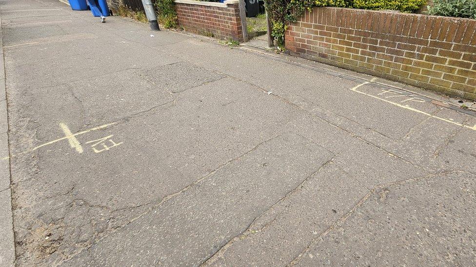 Pavement marked for EV chargers on Dereham Road, Norwich.