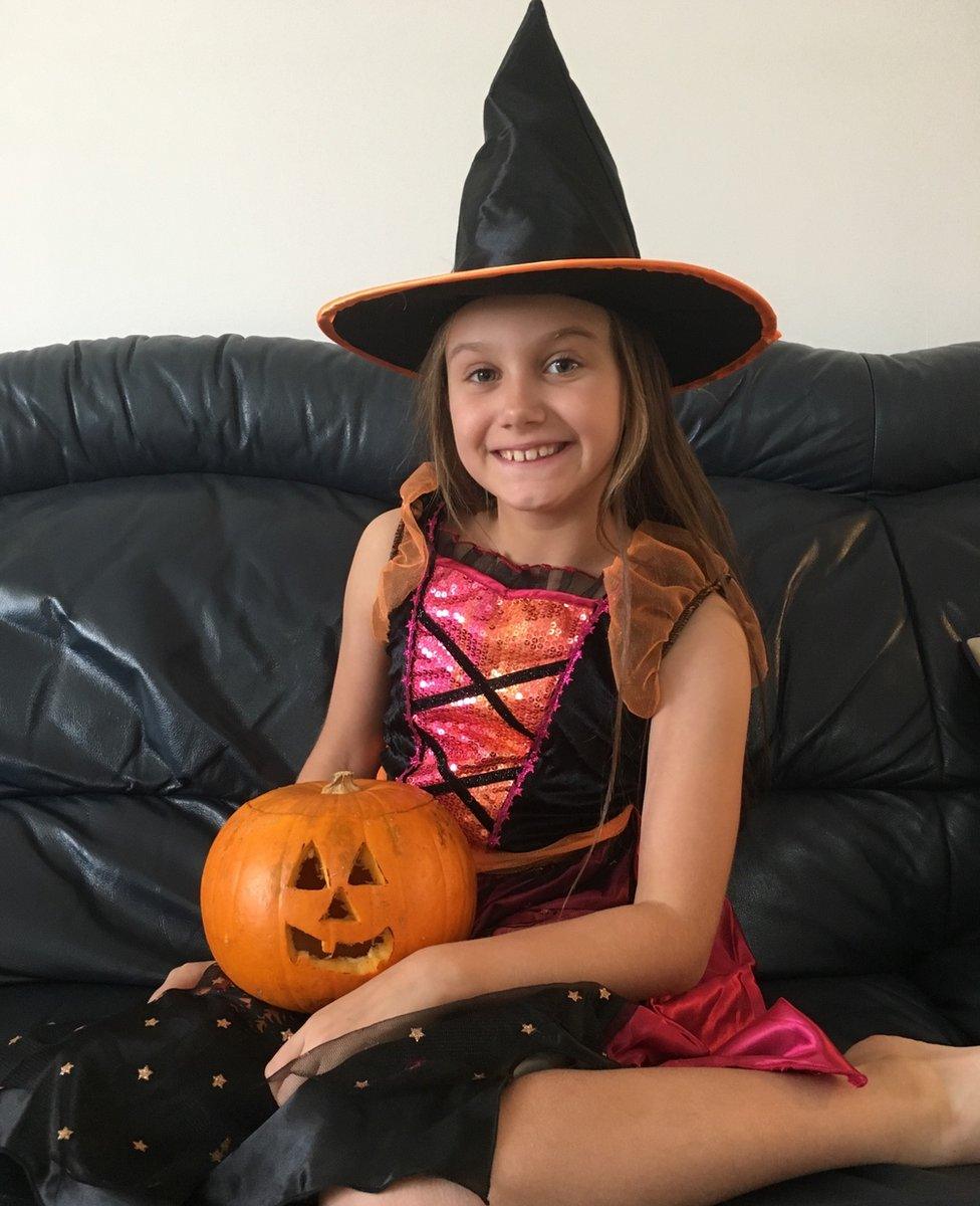 This is eight-year-old Freya with her pumpkin that she cut all by herself - she's very proud!