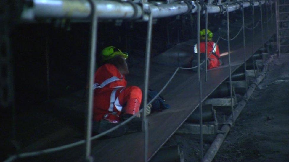 Miners on the conveyor belt at Kellingley Colliery