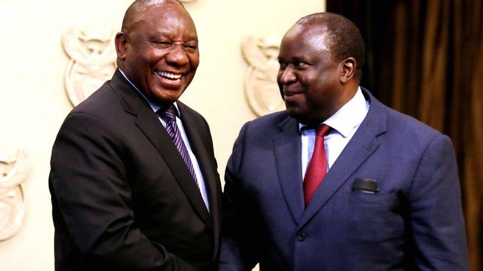 President Cyril Ramaphosa (L) with minister Tito Mboweni