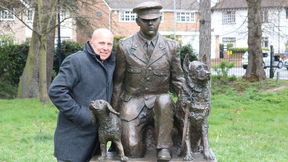 Paul Nicholls with the statue