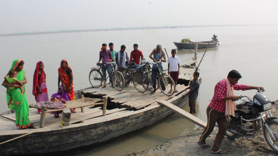 Villagers get off the boat