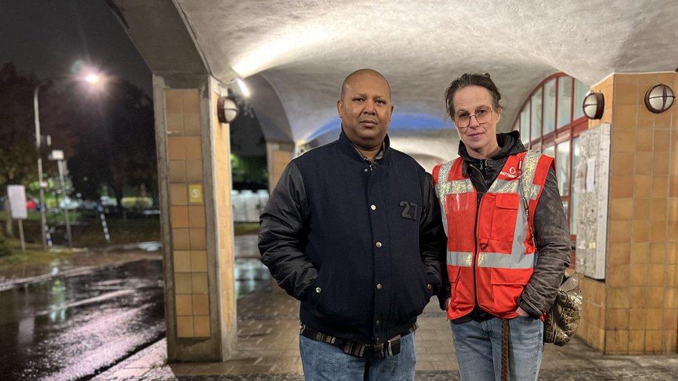 Libaane Warsame (L) on a night walk in Jarva with fellow nightwalker Ida Krissa