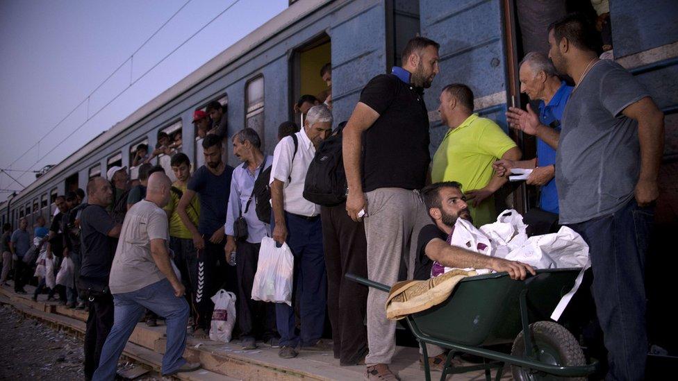 Migrants board a train on Greece-Macedonia border - 18 September