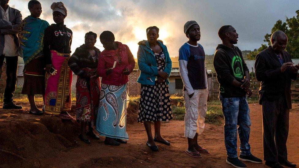 People in a voting queue