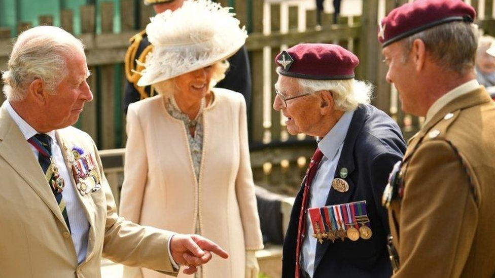 Prince Charles and Camilla, Duchess of Cornwall speak with veterans during the VJ Day National Remembrance event.