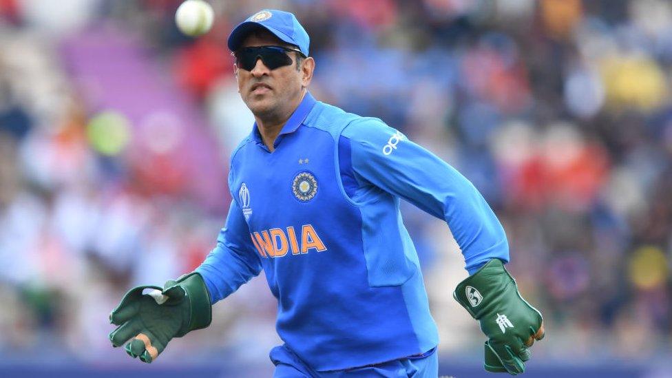 India's Mahendra Singh Dhoni fields during the 2019 Cricket World Cup group stage match between South Africa and India at the Rose Bowl in Southampton, southern England, on June 5, 2019