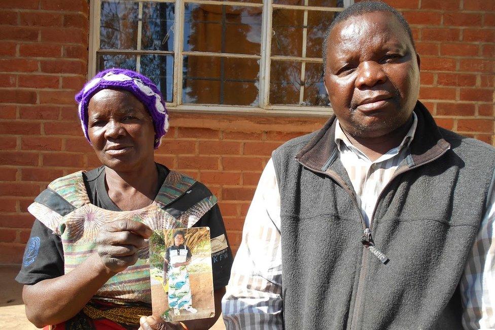 Orlean Mghogho, Tennyson Mghogho and a print-out picture of Fiskani Chipeta