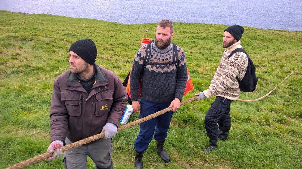 Men from the rope team are needed to pull the hunters back up the cliffs