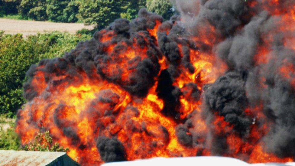 Flames from the crash Hawker Hunter jet