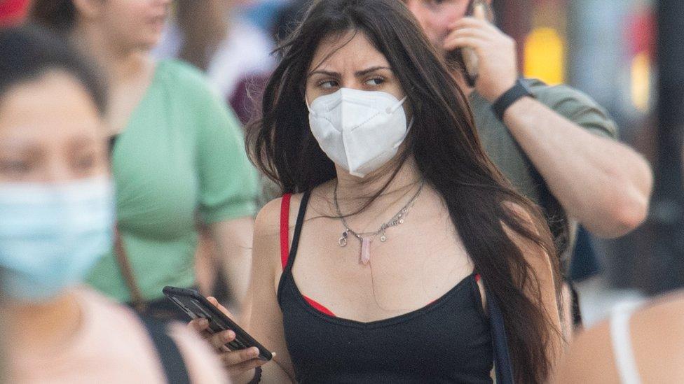 People wearing face mask in central London, after the final coronavirus legal restrictions were lifted in England.