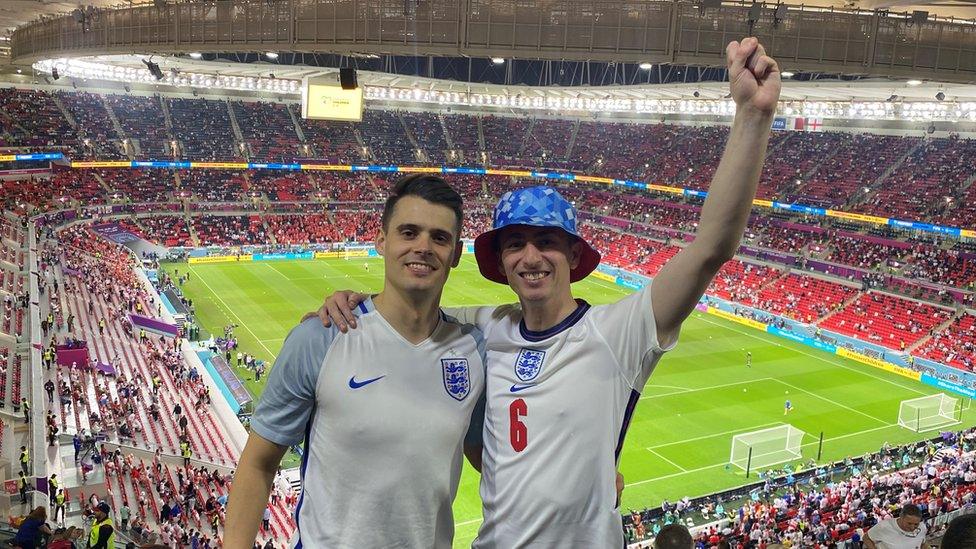 Ryan Shaw with friends outside a stadium at the world cup in Qatar