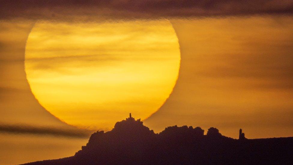 Sun setting behind Manstone Rock