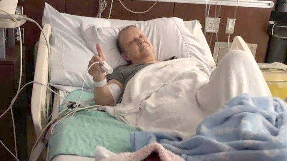 Diane Fargo giving the thumbs up in her hospital bed