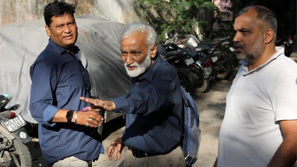 Indian journalist Urmilesh (C) gestures as he leaves the Lodhi Road Special Cell Delhi police office in Delhi, India, 03 October 2023.