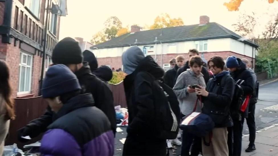 Students queueing in October