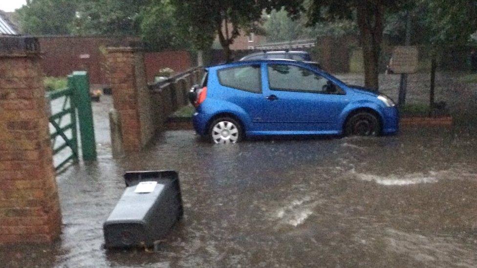 Felicity Baker pictured the flooding outside her house in Hertfordshire