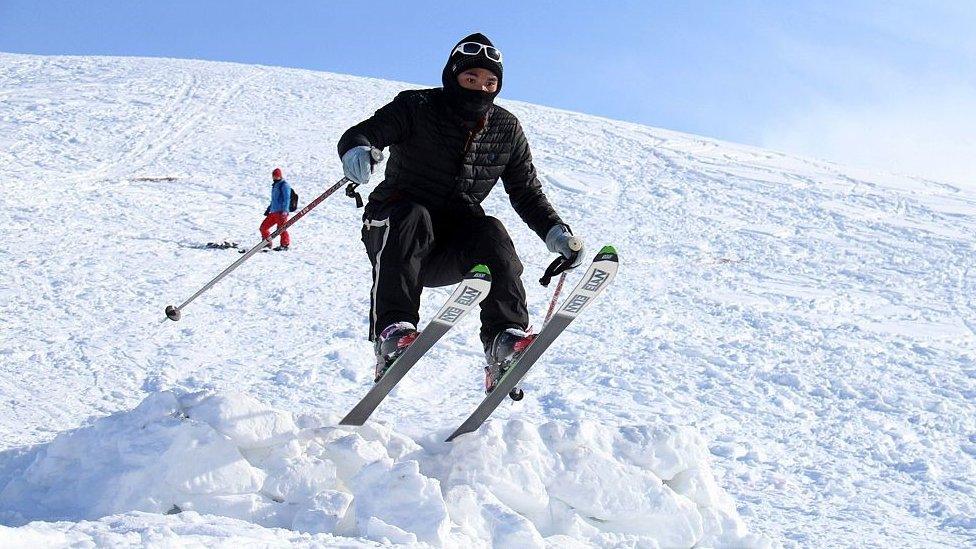 An Afghan competitor takes part in the sixth annual ski challenge event in Bamiyan province on February 5, 2016