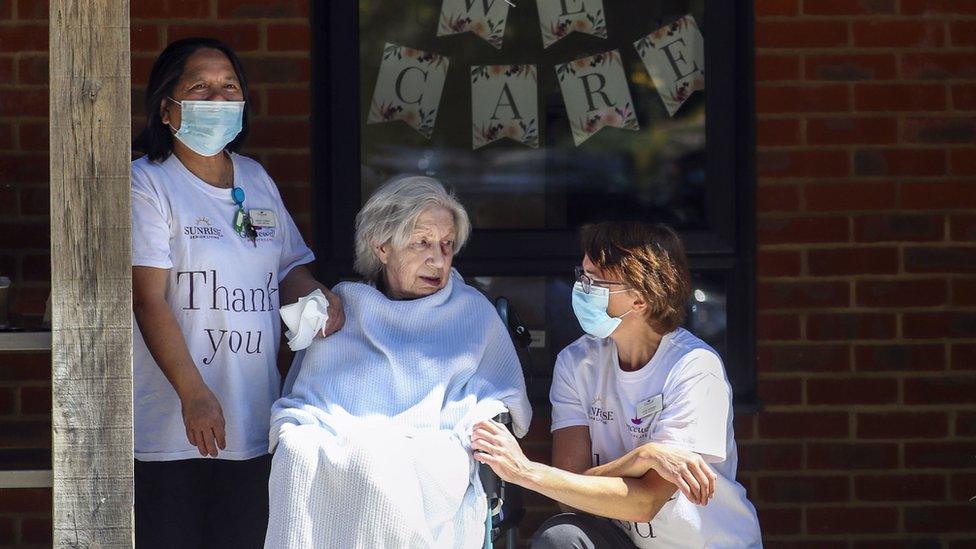 Care workers with resident