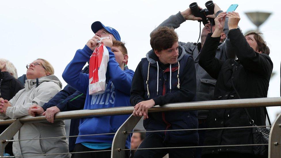 This spectator brought a pair of binoculars to ensure he got a close-up view