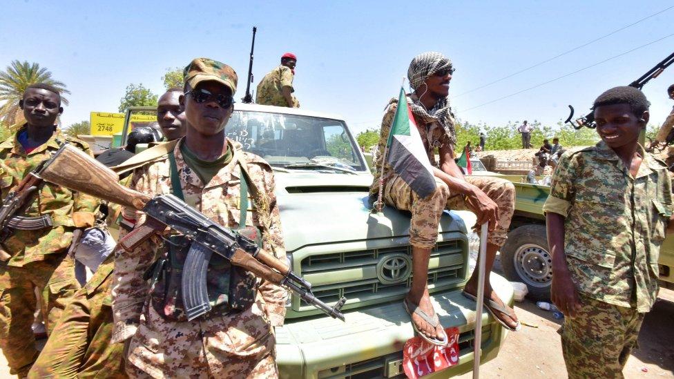 Sudanese armed forces gather near the site of a demonstration close to military headquarters in the capital Khartoum on April 15, 2019