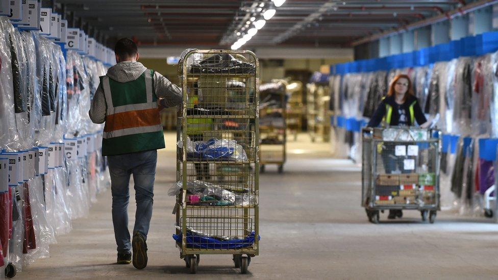 Workers in the Sports direct warehouse