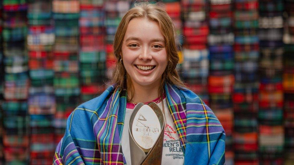 Baton bearer Alice Milivoyevich wears the Team Scotland 2022 tartan at the Lochcarron of Scotland visitor centre, Selkirk