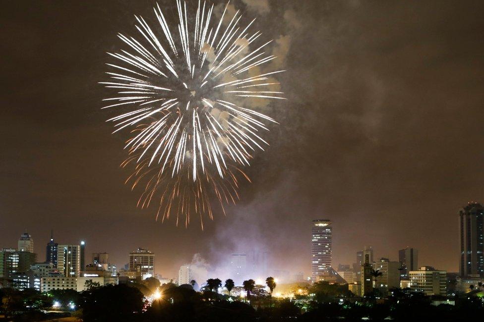 Fireworks illuminate the night sky over the Kenyatta International Convention Centre (KICC) during New Year"s Eve celebrations in Nairobi, Kenya