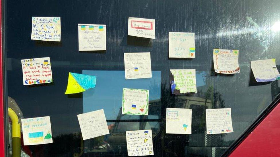 Handwritten notes were taped to the front a fire engine