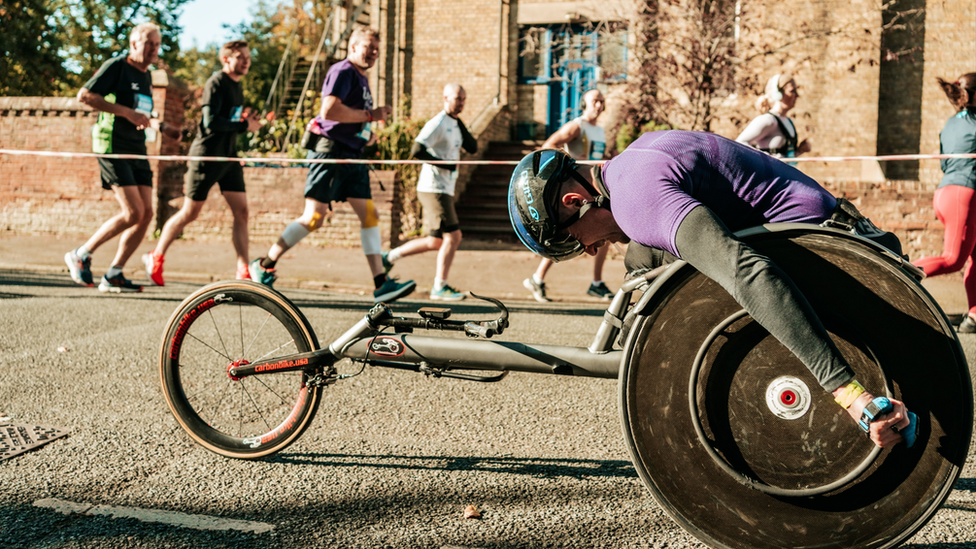 man in a wheelchair racing