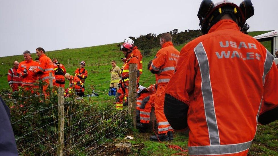 Fire crews around the mine shaft