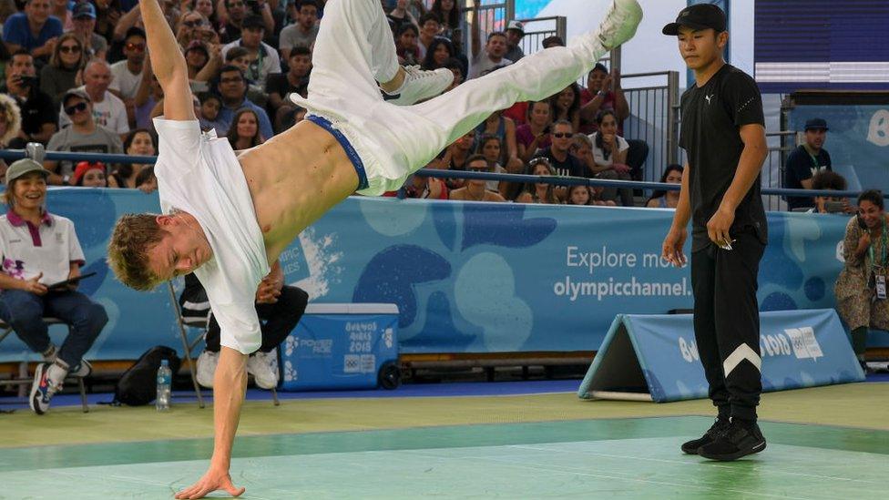 Russia's b-boy Bumblebee (L) competes against Japan's b-boy Shigelix during a battle at the Youth Olympic Games in Buenos Aires