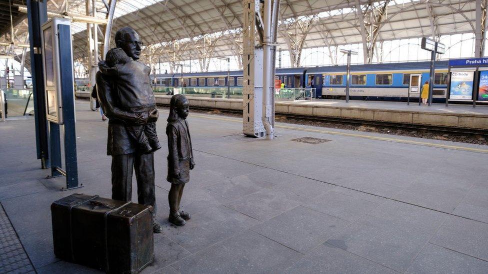 A statue of Sir Nicholas Winton and two children at Prague Central Station