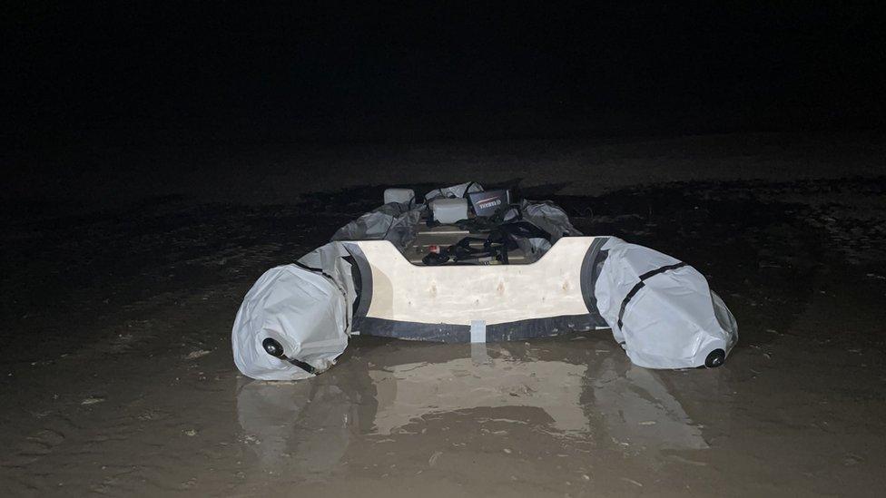 Deflated boat on a Calais beach