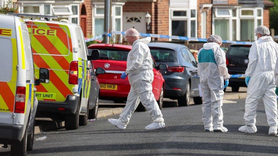 Forensic officers near to the scene in Kingsheath Avenue