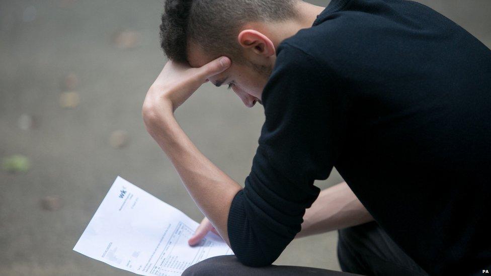 Student reading his exam results