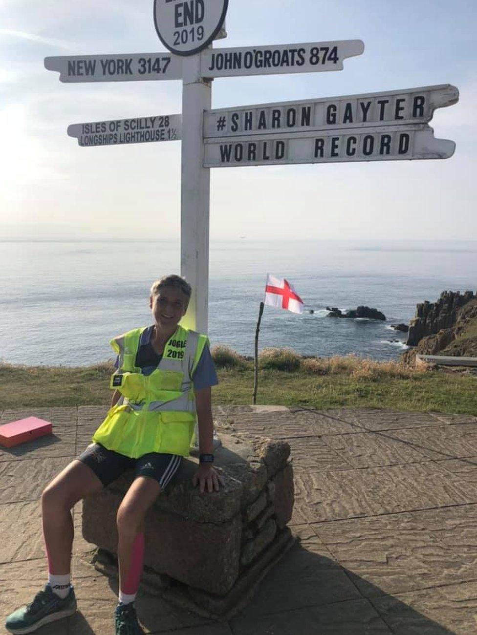 Sharon Gayter under the Land's End location sign