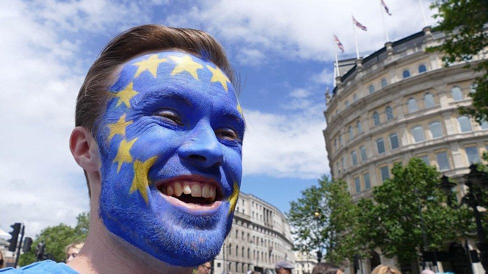 man with eu flag on face