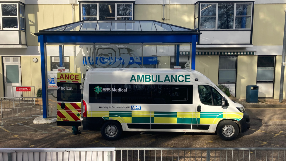 Hospital building and ambulance