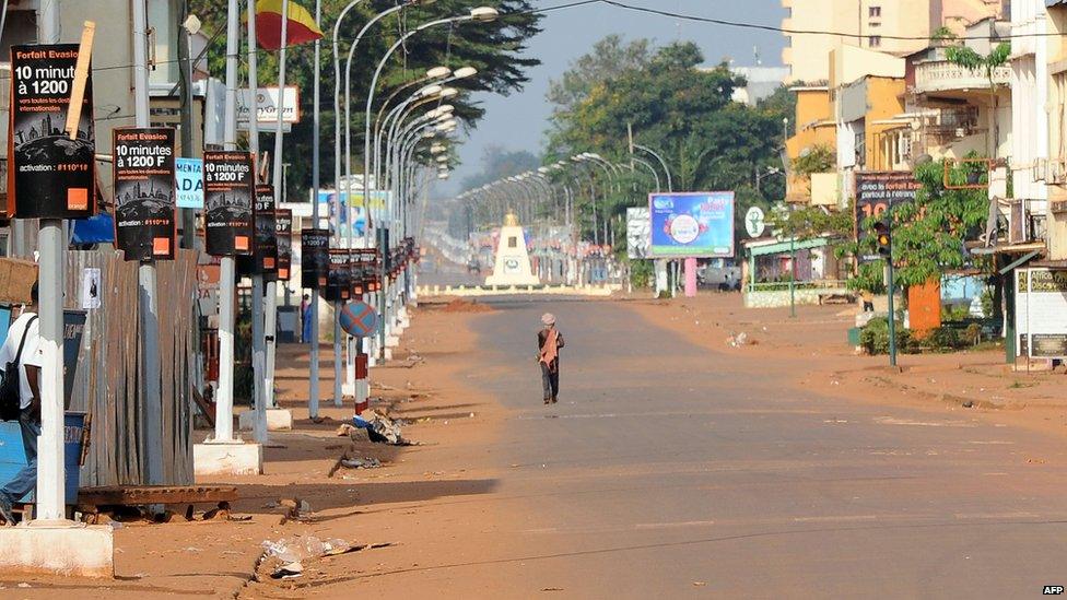 A man walks down the middle of a street of Bangui on 5 December, 2013