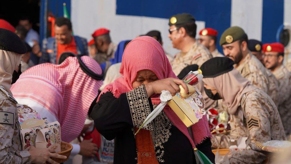 An evacuated woman reacts as she arrives via assistance from Saudi Arabia from Sudan to escape the conflicts, at Jeddah Sea Port, Jeddah, Saudi Arabia, on 26 April