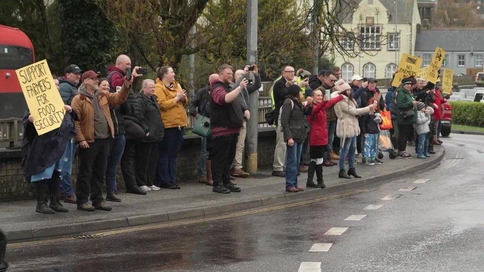 Community tractor protest on side of road