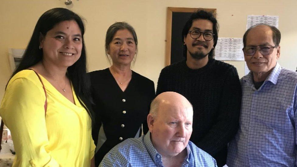 Linh Spearing and her family with Captain Healey Martin