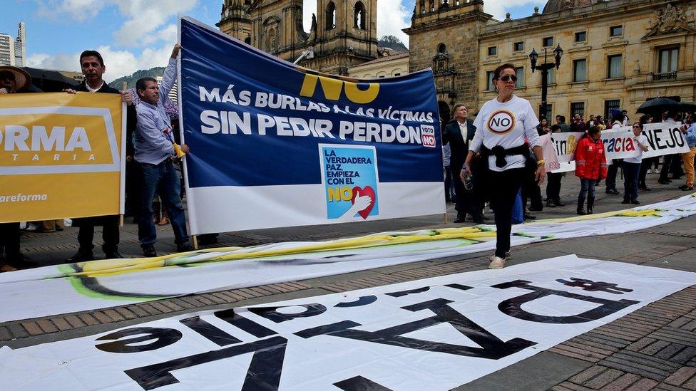 Protesters gather outside Congress in Bogota for the debate. 30 Nov 2016