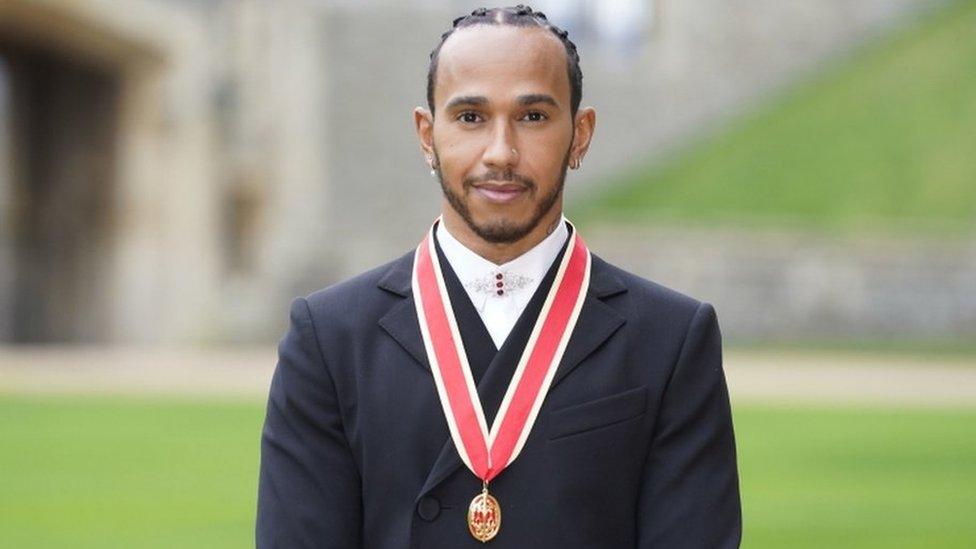 Sir Lewis with his medal